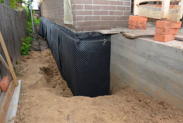 Happy homeowners after waterproofing job in Paeonian Springs